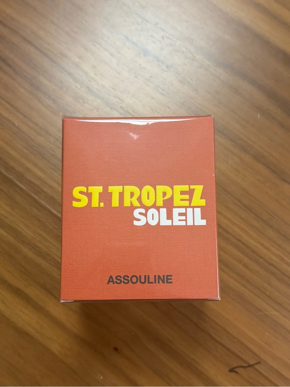Assouline St. Tropez Soleil Decorative Candle — Orange and Yellow Cover